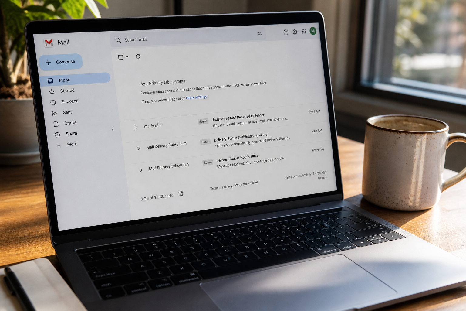 photorealistic close-up of a laptop screen showing an empty email inbox with a few spam warnings, coffee cup beside it, natural morning light