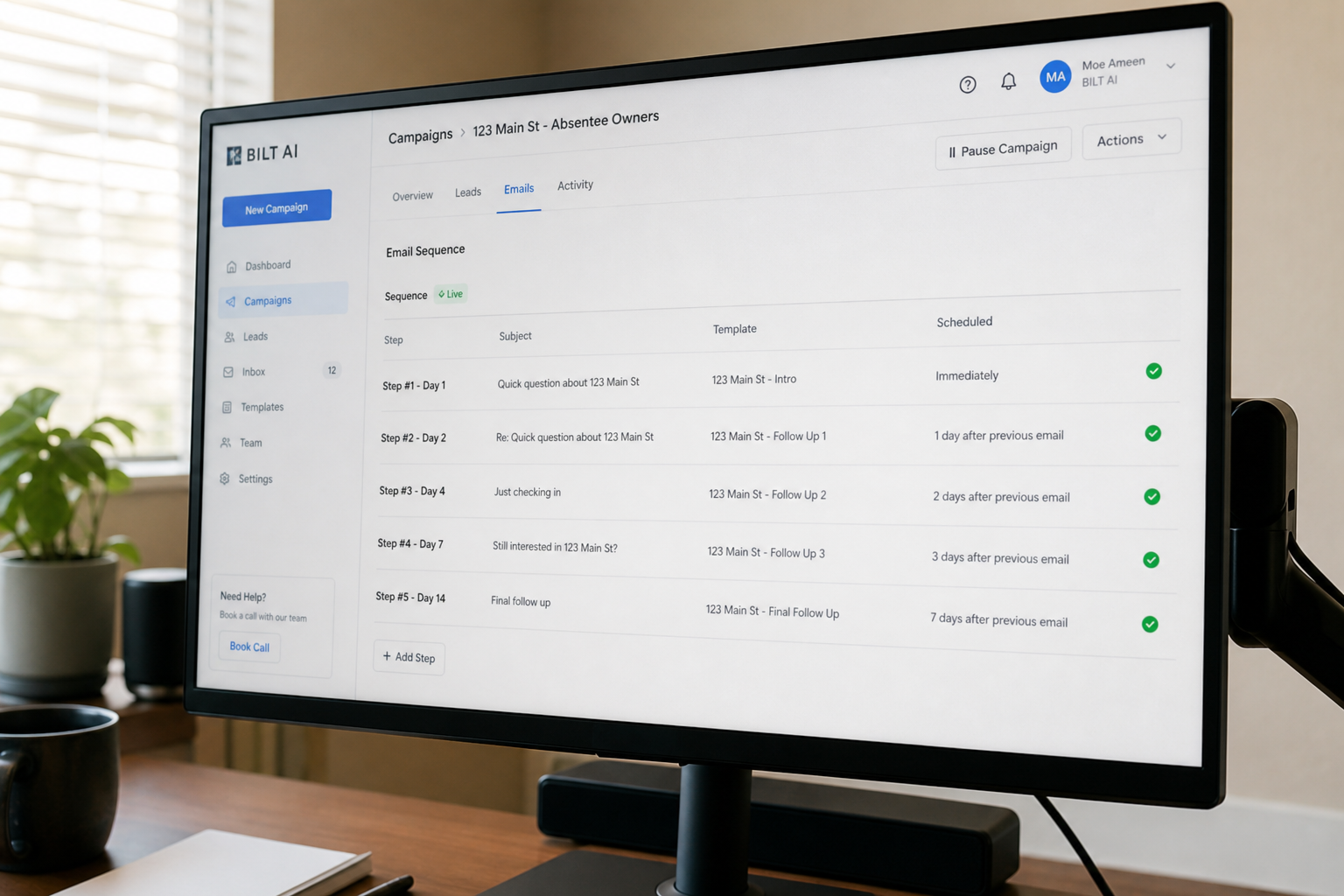 photorealistic scene of a computer screen showing an email campaign dashboard with multiple follow-ups scheduled, clean interface, natural desk environment, morning light