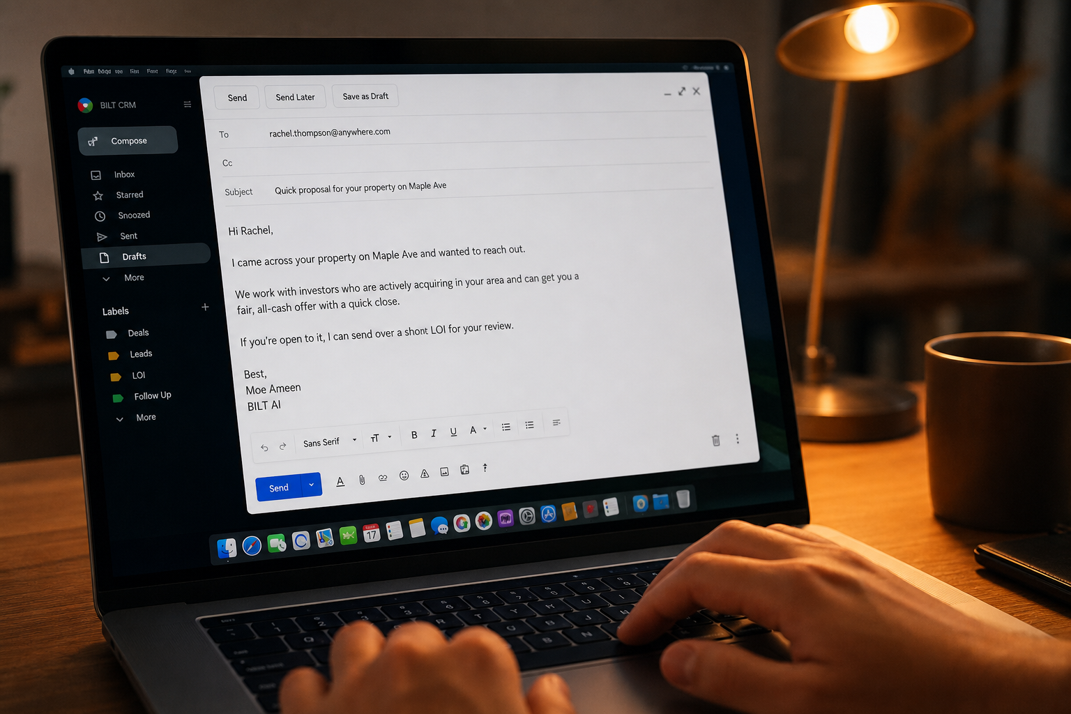 close-up of a laptop screen with an unsent email draft, hands hovering over keyboard, warm desk lamp lighting, realistic office setting