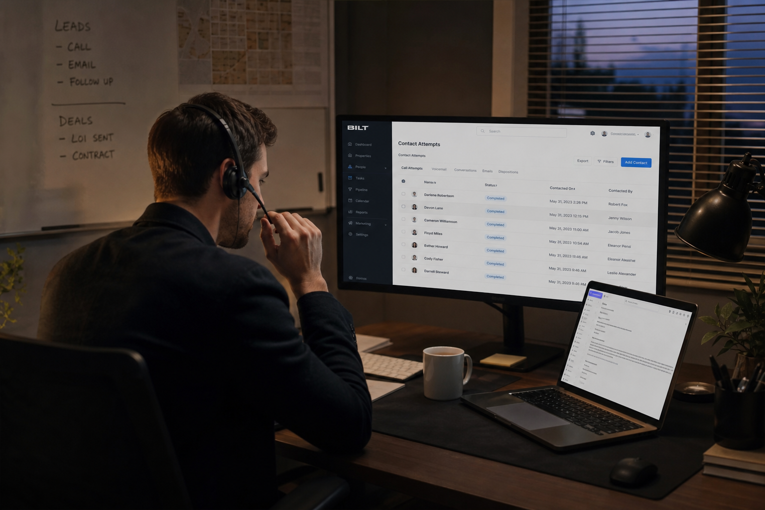 photorealistic scene of a real estate agent making calls at a desk with a headset, CRM screen showing contact attempts, evening office lighting, focused expression